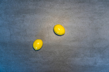 lemon on a gray background - obrazy, fototapety, plakaty