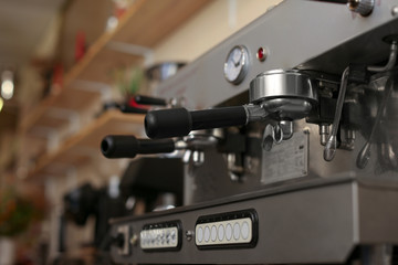 Fototapeta na wymiar Modern electric coffee machine coffee machine with portafilters, closeup. Space for text
