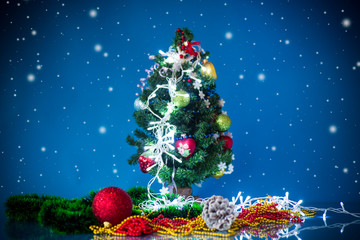 Christmas toys with a Christmas tree on a blue background