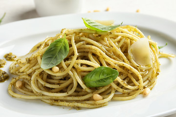 Delicious basil pesto pasta on plate, closeup