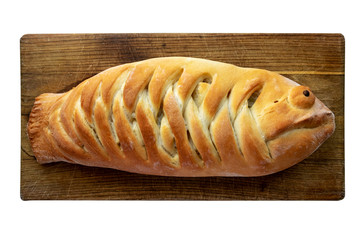 Funny  fish pie  on the wooden board. Tasty food.