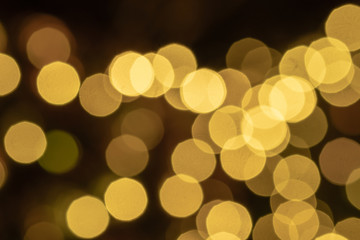 Yellow gold light blurred and bokeh. Wallpaper and background concept.