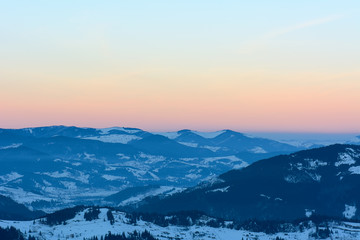 Fototapeta na wymiar Winter evening in the mountains