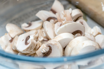 Sliced mushrooms are in a dish