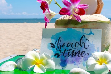 Calligraphy at beach. About beach time on vacation. Also have coconut and flowers make feeling fresh.