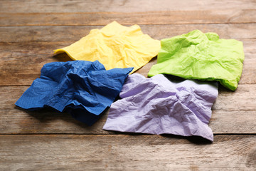 Crumpled paper napkins on wooden background. Personal hygiene