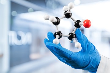 Close up of Molecular structure model in hand on background