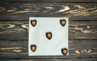 cupcakes with hearts on a wooden background