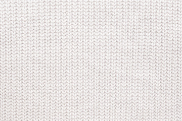 Abstract knitted background. White woolen sweater texture. Close up picture of  knitted pattern. - 235953711