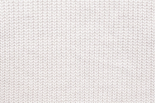Fototapeta Abstract knitted background. White woolen sweater texture. Close up picture of  knitted pattern.