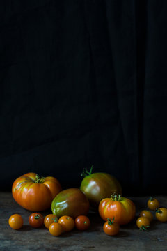 Tomatoes against a black background