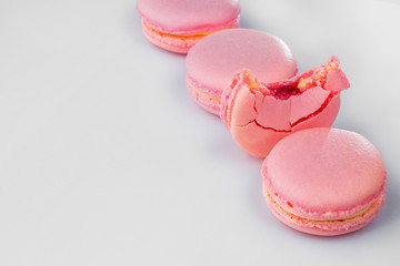 French macarons. Stack pink rose macaron on white background. Colorful macaroons