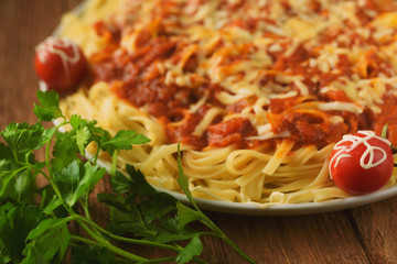 handmade pasta in tomato sauce with spices and vegetables in cheese breaded, decorated with parsley and cherry tomatoes