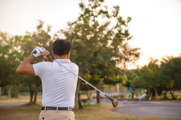 Asian golfer playing golf on a country club