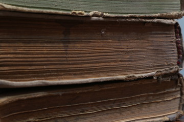 Yellowed pages of the old dilapidated book. Old book.