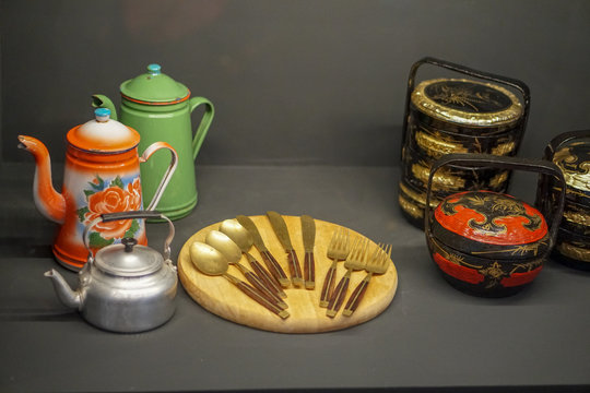 Vintage pot, traditional utensil and Traditional tiered Bakul Siah Wedding Basket used by Peranakan Chinese in parts of Asia