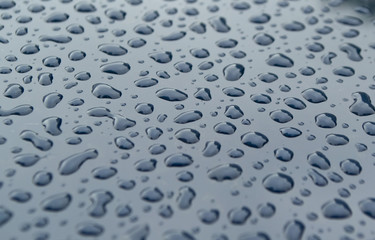 Raindrops on the car's surface