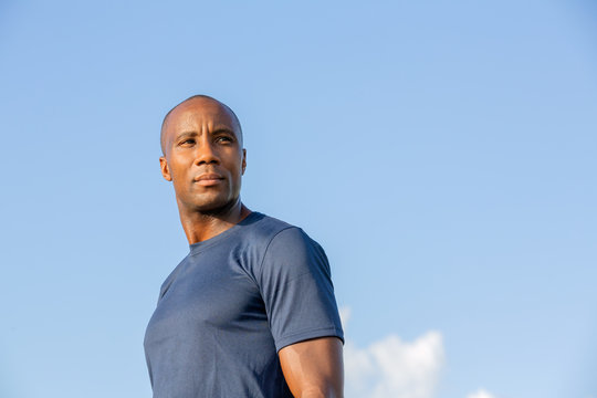 Portrait of young man against blue sky