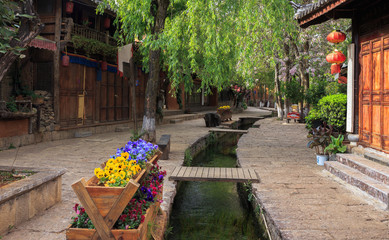 On the street of ancient town Shuhe, Lijiang, UNESCO World Heritage Site. Yunnan province, China....