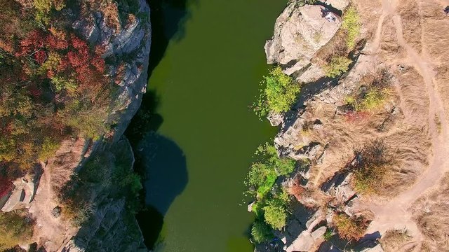 aerial view of autumn canyon, mountain river in canyon, River flowing among rocks in autumn, flight above the mountain river, flying over buky canyon in the autumn