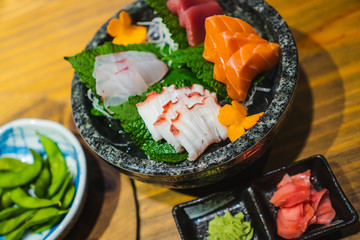 Sashimi set on a wooden table in a Japanese restaurant