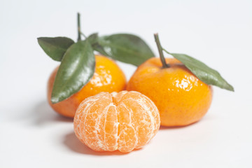 Ripe mandarins with green leaves