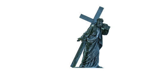 The road to Golgotha. Ancient statue of Jesus Christ with cross. Faith, religion, God, suffering concept.