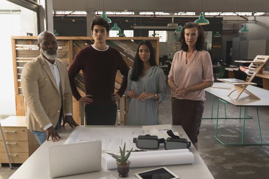 Portrait of architects standing in office