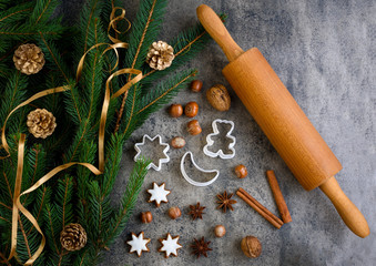 Christmas gingerbread with decoration on a wooden board. Top view, flatlay