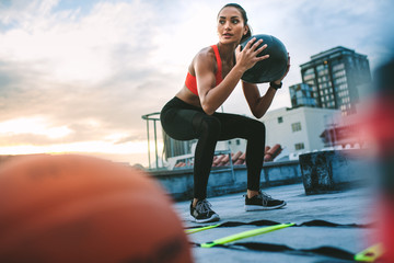 Fitness woman doing workout on the rooftop