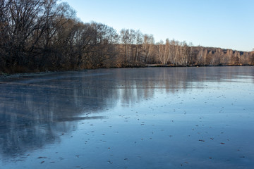 a frozen river shore