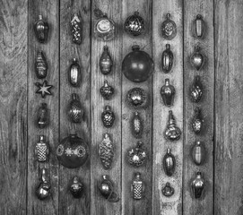 set of vintage Christmas tree decoration on wooden retro grunge background, top view, top view black and white photo