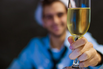 businessman smiling with glass of champagne in the office