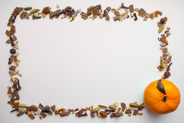Frame of mulled wine ingredients, mandarine on white background. Flat lay, top view Christmas or New Year holiday concept