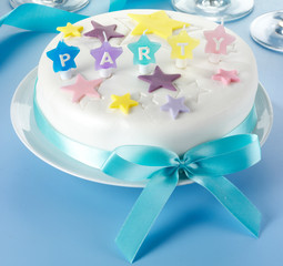 ICED PARTY CAKE ON BLUE