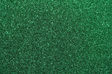 Sparkling macro green glitter abstract background