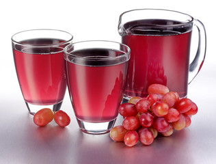 GLASS AND JUG OF GRAPE JUICE