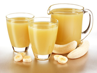 GLASS AND JUG OF BANANA JUICE