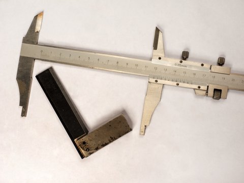 Carpente and shingel compass on a white background