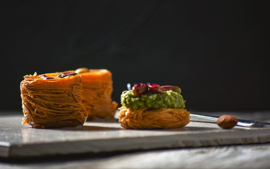 Turkish delight on white rustic background. Turkish deligh set. Assorted traditional turkish delight on light background