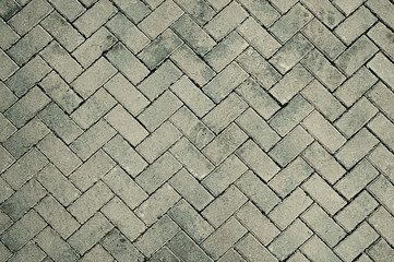 Old grey mosaic pavement texture background