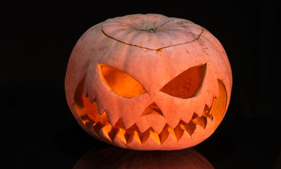 Scary pumpkin on black background