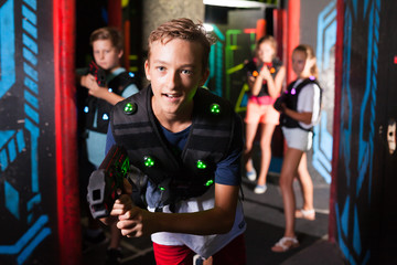 Boy having fun on lasertag arena
