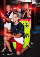 Fototapeta na wymiar Teen kids with laser guns