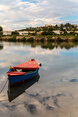 Fototapeta premium Small fishing boat at the ancient punic port in Carthage, Tunisia