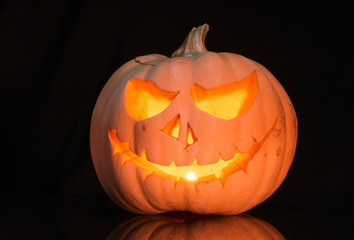 Scary pumpkin on black background