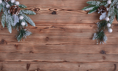 Christmas composition, fir branches on wooden background
