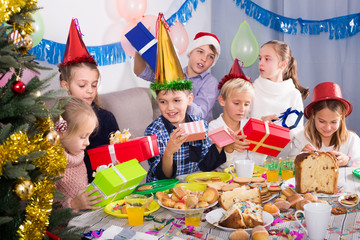 Cheerful exchanging Christmas gifts