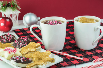 Hot chocolate drink and plate with marshmallows of different shapes for Christmas.