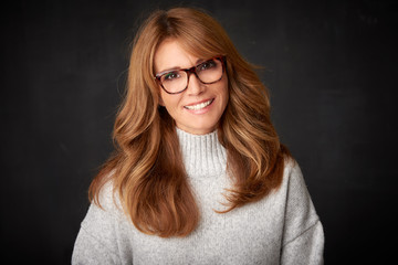 Fototapeta premium Close-up studio portrait of attractive middle aged woman